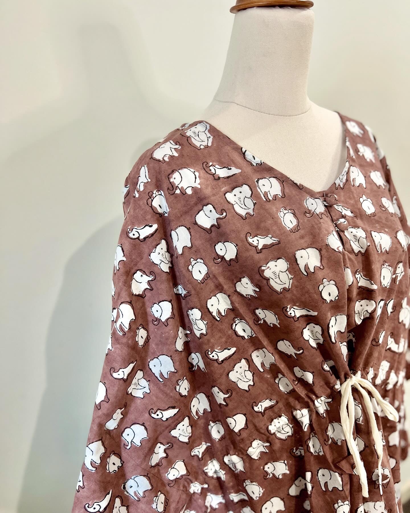 Brown cotton kaftan with elphant hand block printed pattern close up picture