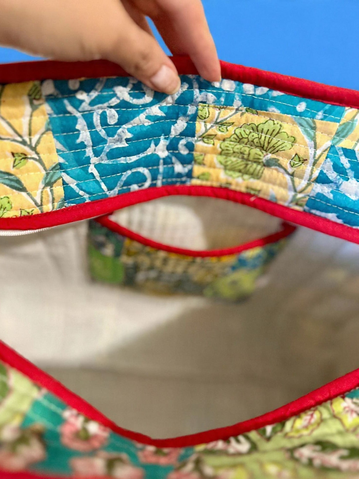 Colourful handcrafted patchwork tote bag with hand block print details and inside pocket.