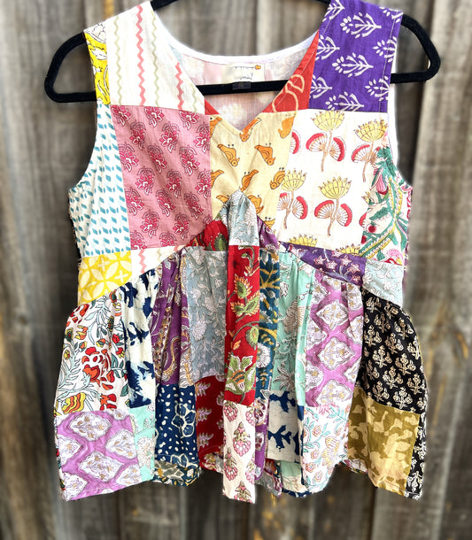 Colorful hand block patchwork top on a wooden background